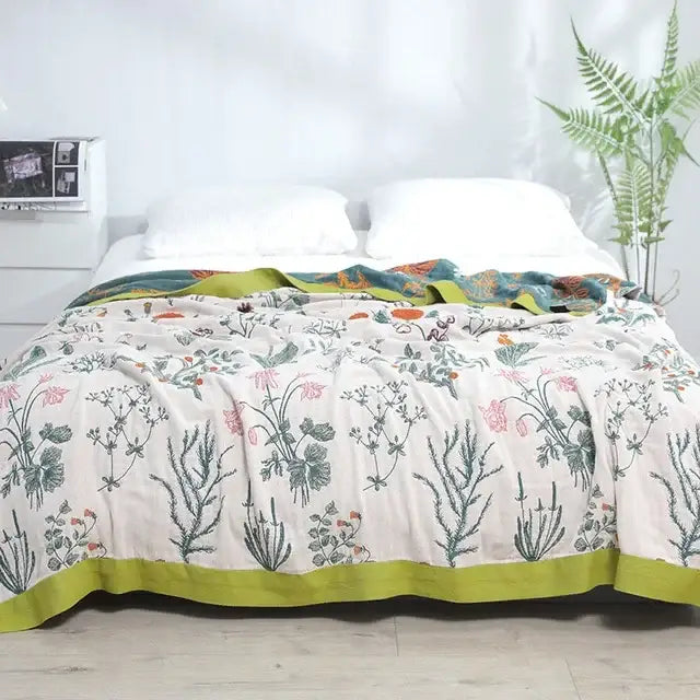 Multicolored decorbites cotton gauze boho throw blanket with off-white quilted botanical print and lime-green border