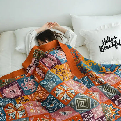 Vibrant multicolored cotton gauze boho throw blanket with bold geometric and floral patterns for bedroom or living room decorbites cotton gauze