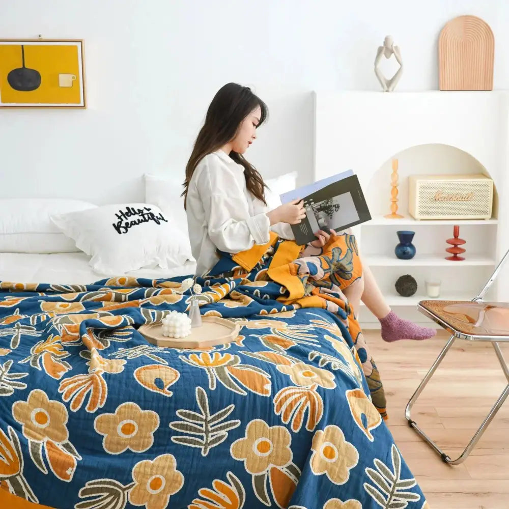 Blue multicolored cotton gauze boho throw blanket with vibrant orange and beige floral decorbites cotton gauze material