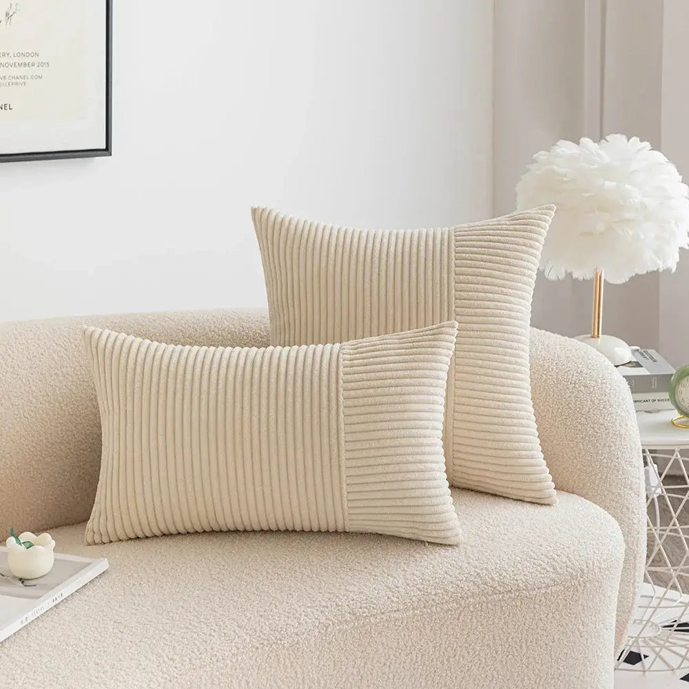 Cream-colored decorbites corduroy striped pillow covers with subtle vertical ribbed texture and solid panel design