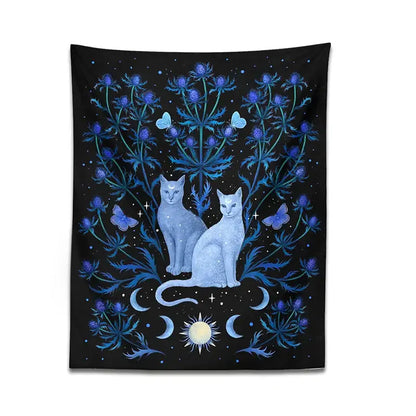 Rectangular black and blue cat tapestry wall hanging featuring two light blue cats with celestial and thistle decorbites cat tapestry