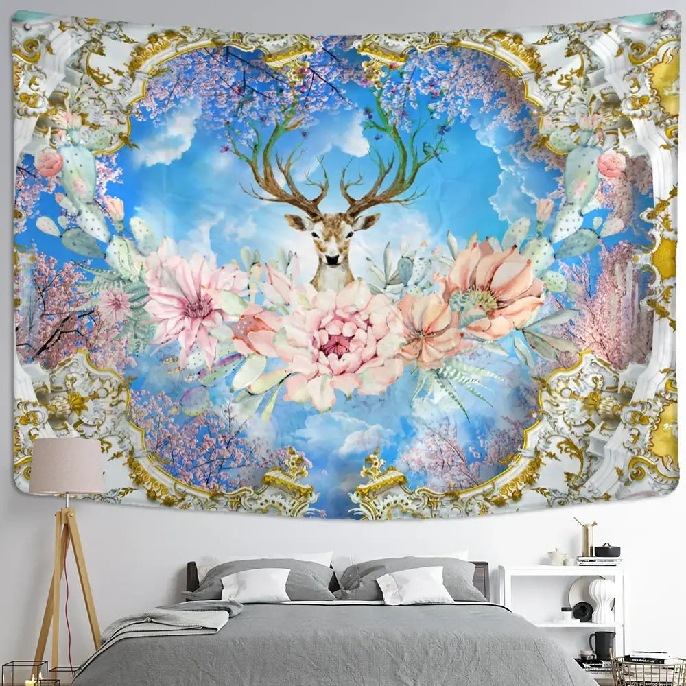Mystical elk tapestry wall hanging with central deer, pink flowers, cactus, blue sky and ornate gold white frame for bedroom decor