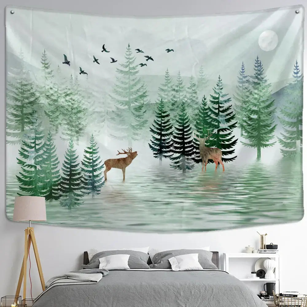 A soft green and white elk tapestry wall hanging featuring deer pine trees birds in flight and a full moon for bedroom decor