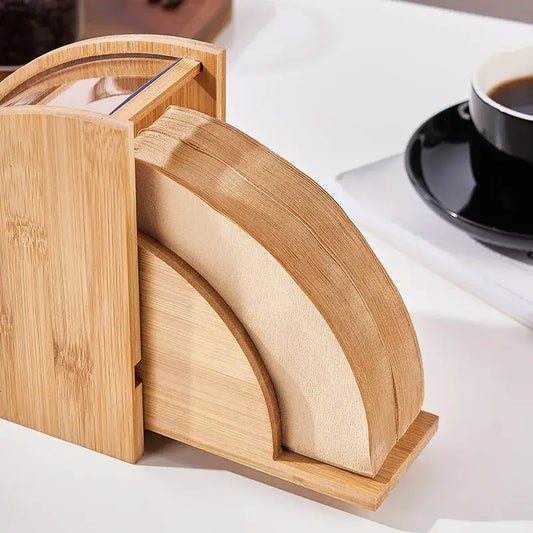 Natural bamboo coffee filter holder with matching bamboo coffee filters featuring wood grain finish and curved design