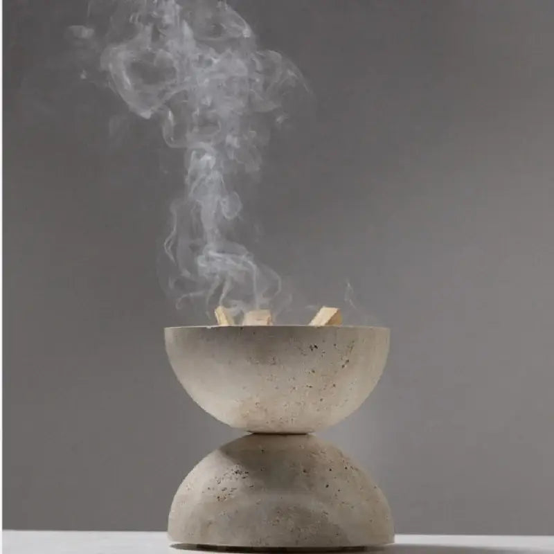 Minimalist beige travertine incense burner with textured light gray concrete surface for living room decorbites decor