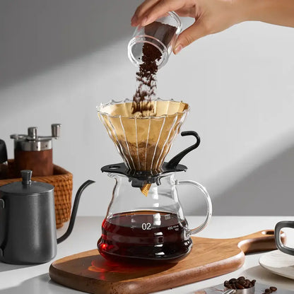 Natural brown cone coffee filter paper with golden fluted glass dripper and black base for decorbites coffee filter use