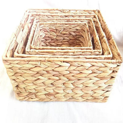 Set of four natural beige woven rattan storage baskets by decorbites made of dried reed for office organization