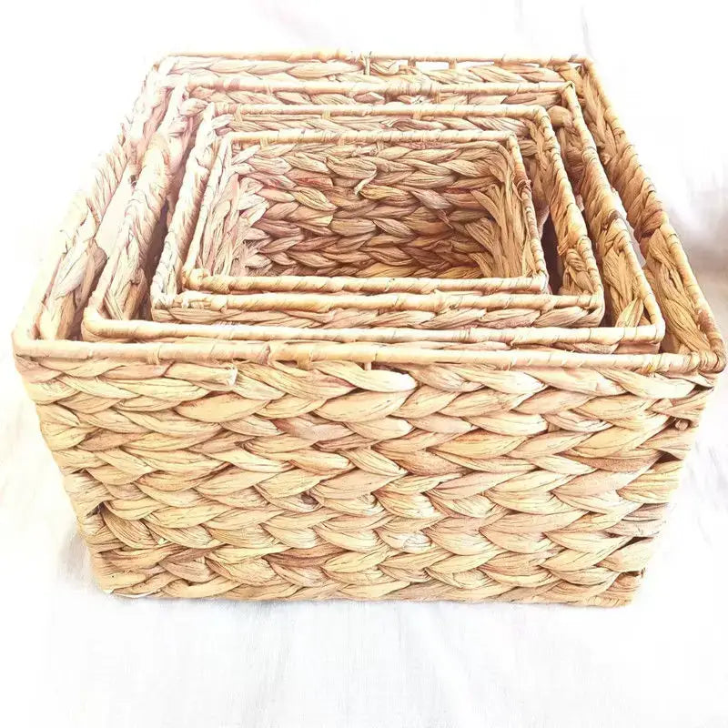 Set of four natural beige woven rattan storage baskets by decorbites made of dried reed for office organization