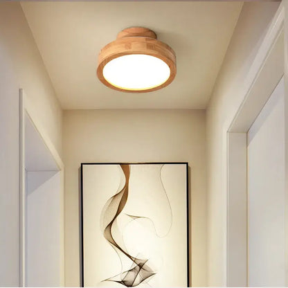 Natural circular wood ceiling lamp with warm glowing circular bulb perfect for living room decorbites circular wood lighting