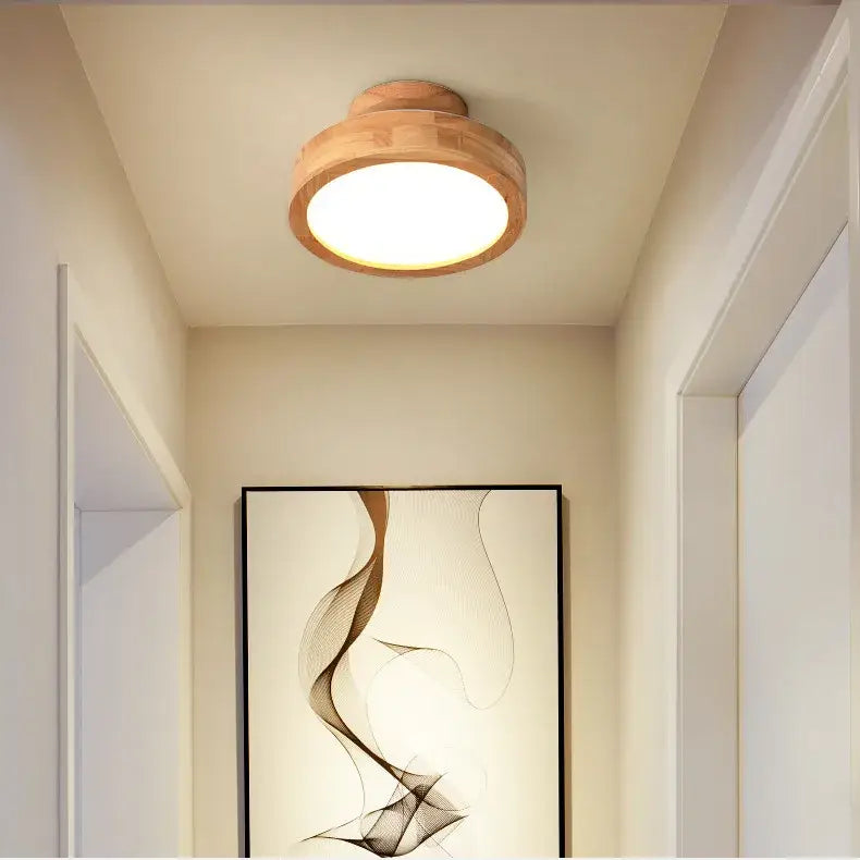 Natural circular wood ceiling lamp with warm glowing circular bulb perfect for living room decorbites circular wood lighting