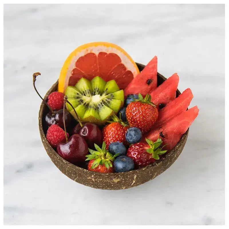 Natural dark brown handcrafted coconut bowl set kitchen tableware filled with fresh fruit by decorbites coconut bowl