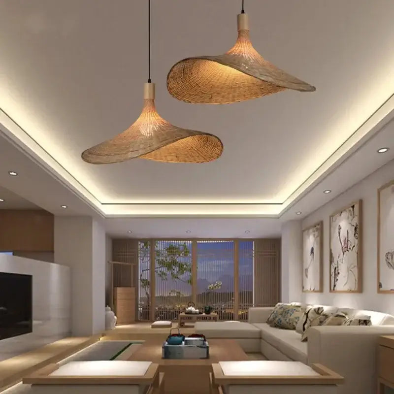Two elegant light brown bamboo wicker chandelier pendant lights with a natural design hang from the ceiling