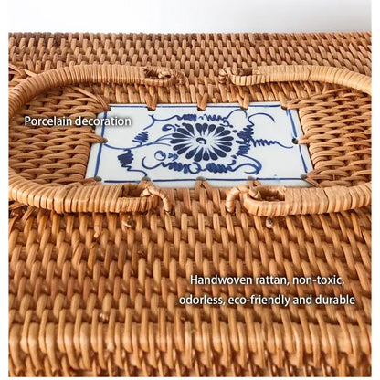 Natural tan handwoven rattan storage box with ceramic lid featuring blue floral decorbites handwoven rattan decor