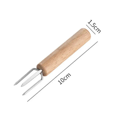 Natural wood three prong espresso stirrer with light brown handle and metallic tines for decorbites espresso stirrer use