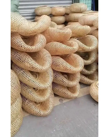 Handwoven natural bamboo pendant light with a twisted ring shape and open lattice design for dining room decorbites bamboo pendant