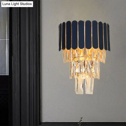 Elegant navy and gold rectangle-cut crystal wall sconce with cascading droplets for living room lighting idea