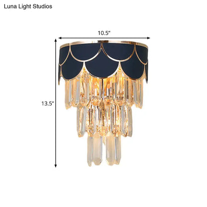 Elegant navy blue wall sconce with gold trim and rectangle-cut crystal prisms for living room lighting