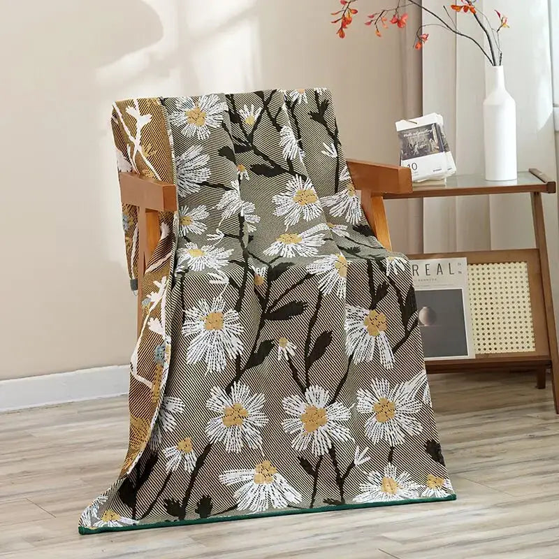 A cozy cotton gauze cat bath towel with vibrant white daisy floral pattern on olive green for bath towel decorbites