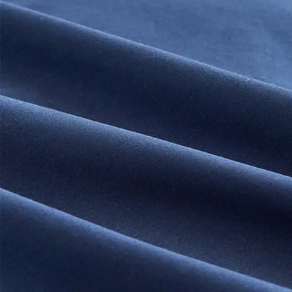 Deep navy blue velvet fabric with soft plush texture and subtle sheen in a solid color decorbites cotton 4pcs bedding set