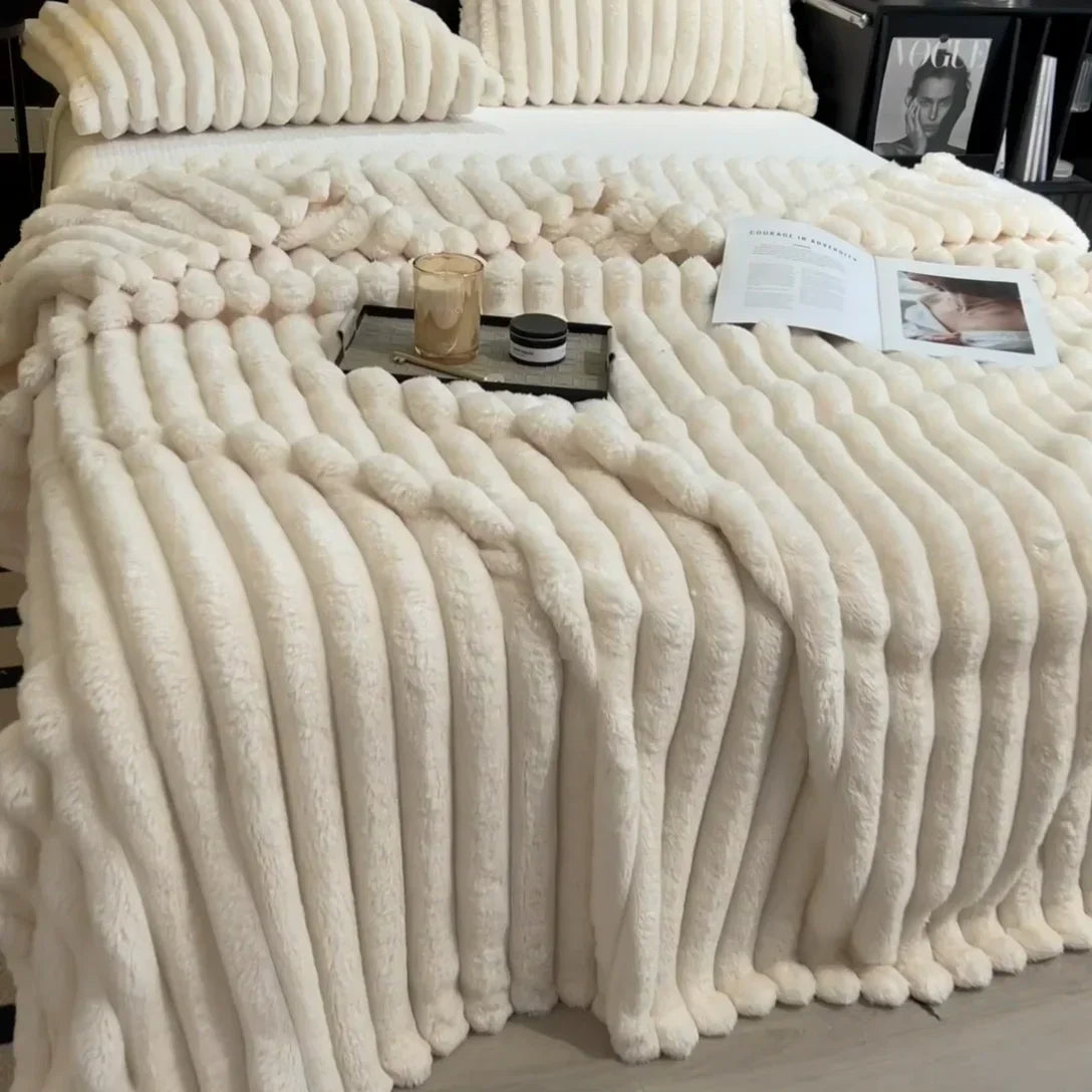 Cream-colored plush ribbed knit throw blanket with soft fuzzy texture made from bamboo fiber for autumn warmth