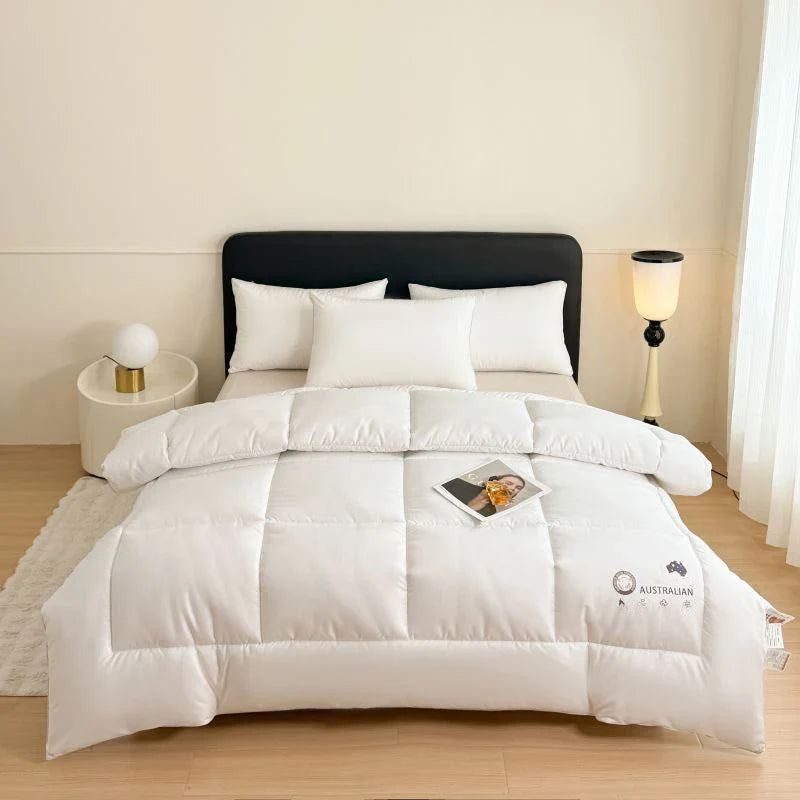 White quilted comforter with plush texture and subtle stitching made of new zealand wool for four season use
