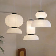 Noguchi pendant light with white rice paper lantern and black metal accents as a dining room shop hanging light
