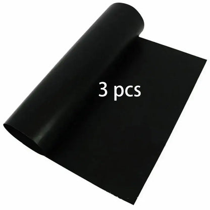 Black smooth-surfaced non-stick bbq grill mat made of flexible material for kitchen and outdoor cooking use