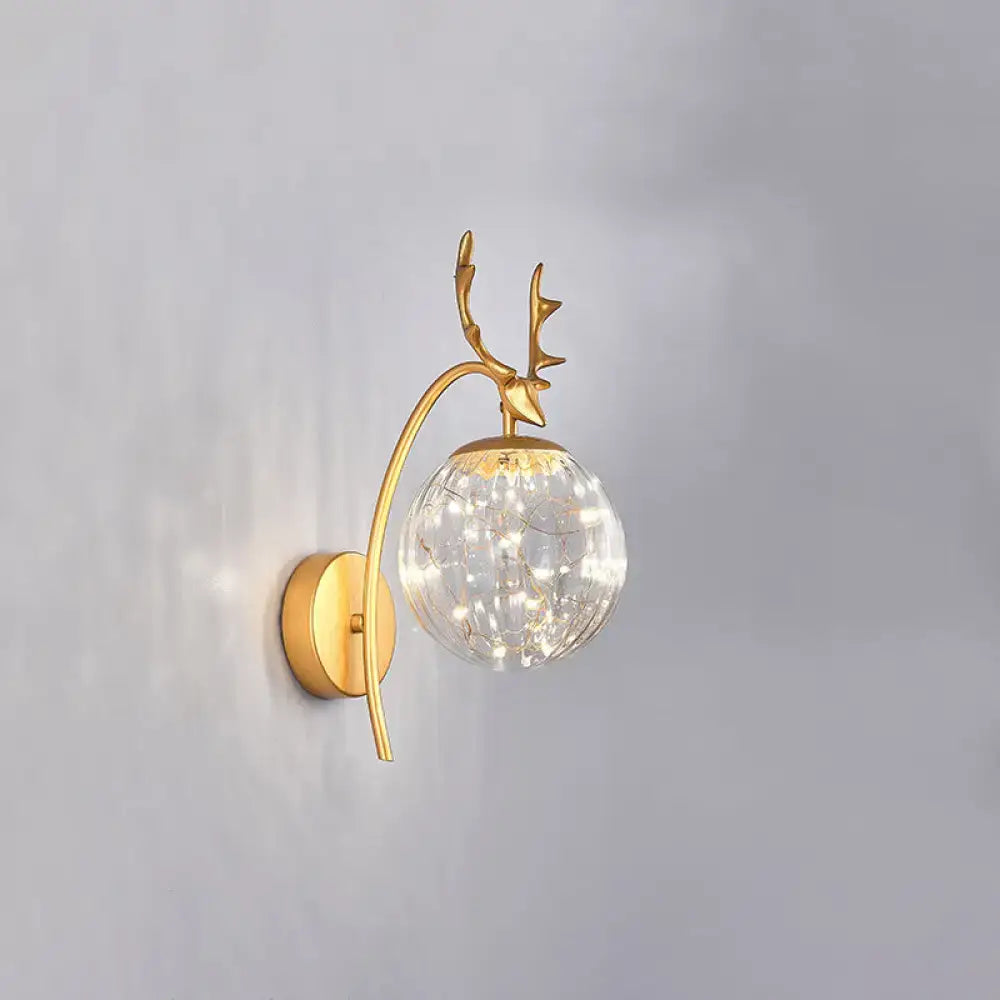 Gold-toned nordic ball wall mount deer-head sconce with crackled glass globe and fairy lights for bedroom decor