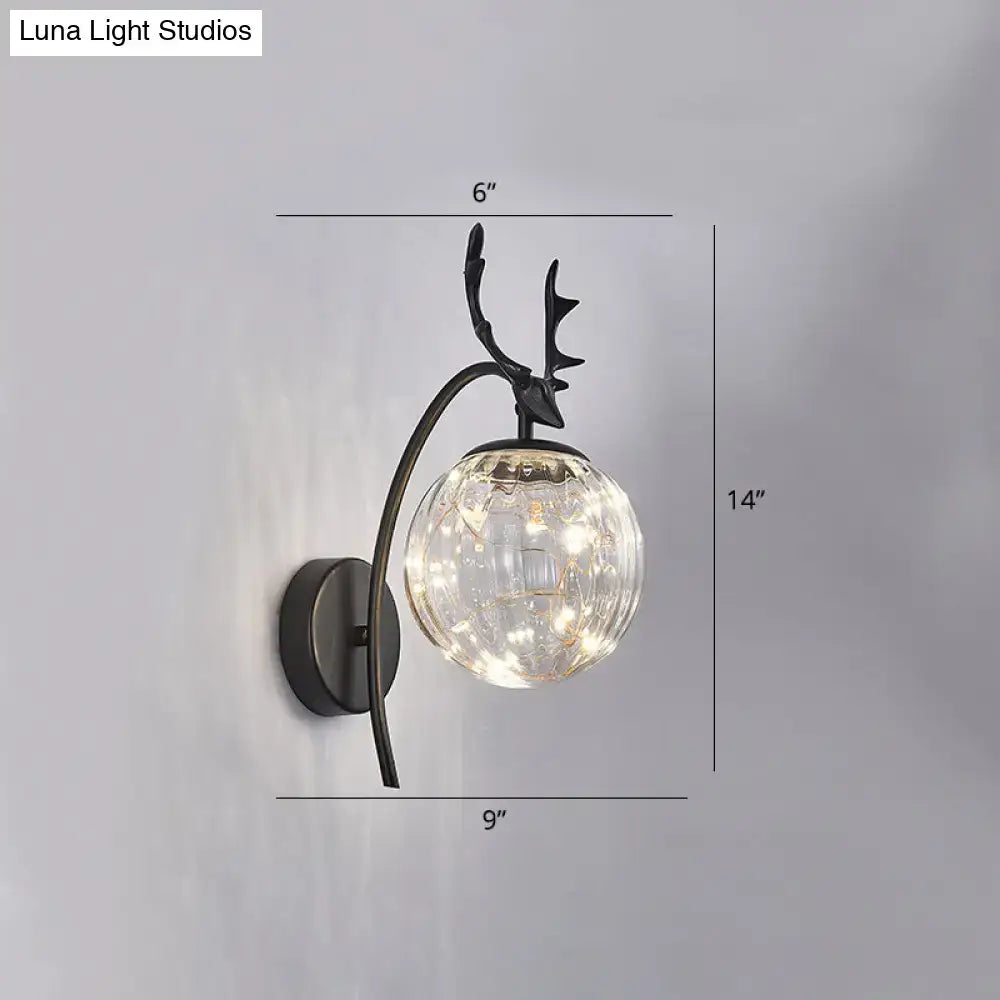 Black metal nordic ball wall mount deer head sconce with textured glass globe and warm led bedroom fairy light