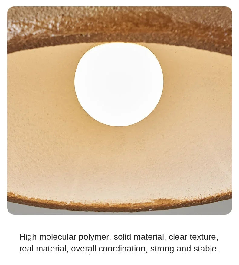 Beige circular high molecular polymer disc with smooth texture and brown edges in nordic bar wabi sabi led pendant lamp