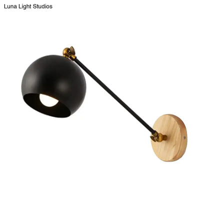 Nordic black and brass spherical wall light with black matte finish, bulb socket for e26 e27, mounted on light wood base