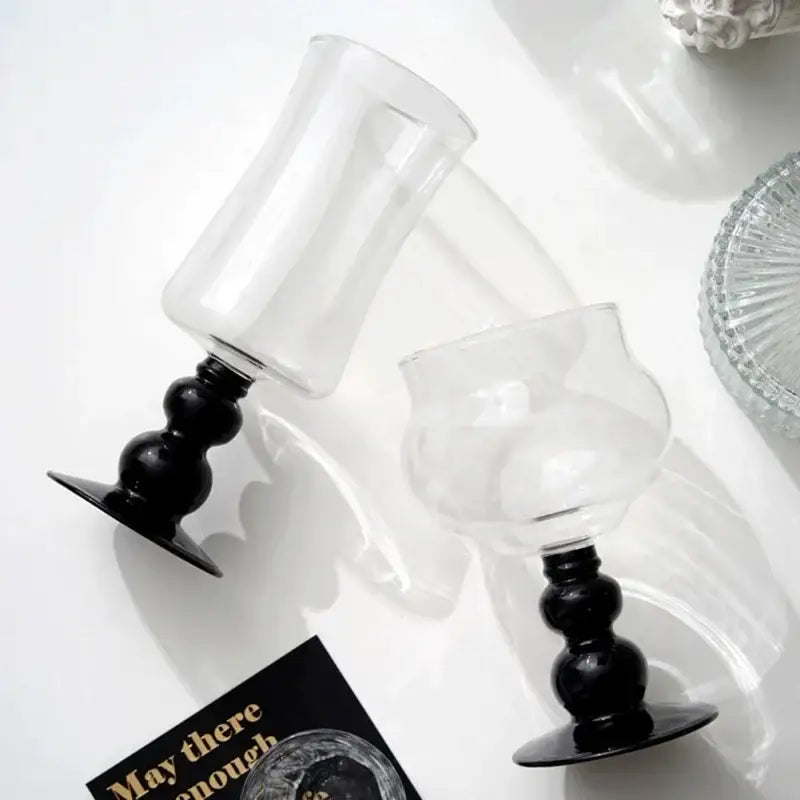 Two clear glass goblets with black beaded stem and flat base from Nordic glass beaded stem decorbites collection