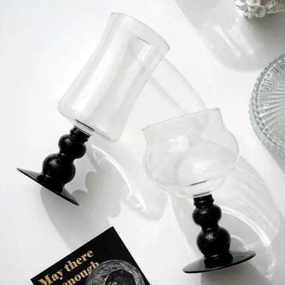 Two clear glass goblets with black beaded stem and flat base from Nordic glass beaded stem decorbites collection