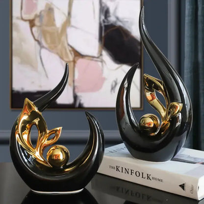 Nordic black and gold ceramic figurine with sleek curved forms and metallic accents for living room desk decor