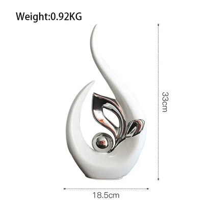 Elegant white nordic ceramic figurine with abstract leaf design and polished silver elements for living room decor
