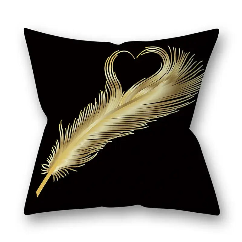 Black throw pillow with golden leaves pillow design featuring a heart-shaped feather pattern for living room decor