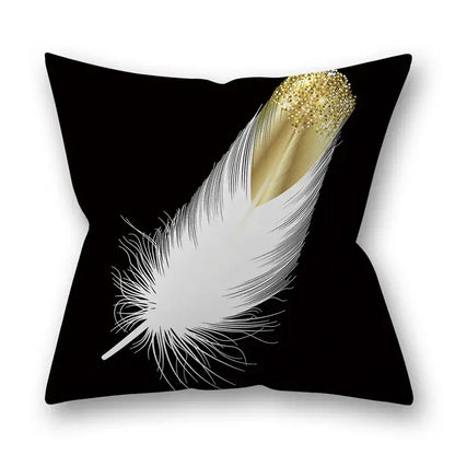 Black throw pillow with white feather and gold glitter-tipped quill design for Nordic golden leaves pillow decor