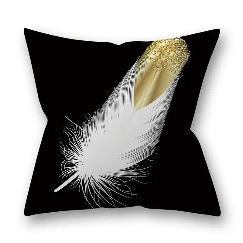 Black throw pillow with white feather and gold glitter-tipped quill design for Nordic golden leaves pillow decor