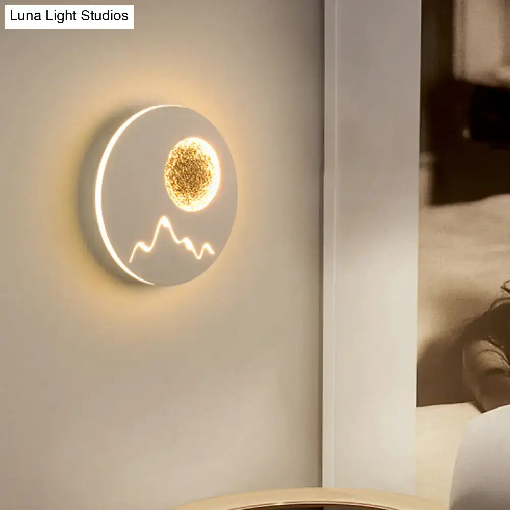 Black white grey nordic wall light fixture with glowing golden sun and mountain silhouette on white base for bedroom use