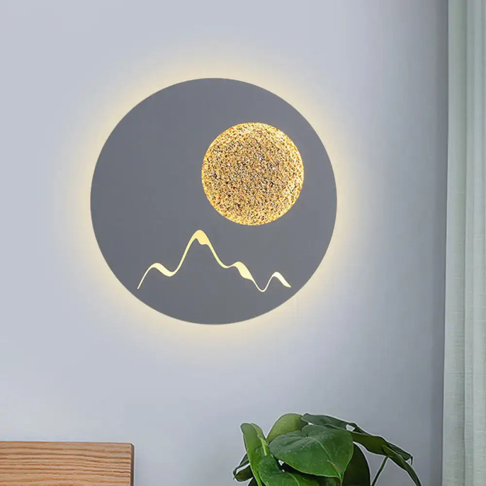 Nordic black white grey wall light with textured gold sun and stylized mountain peaks for bedroom fixture height display