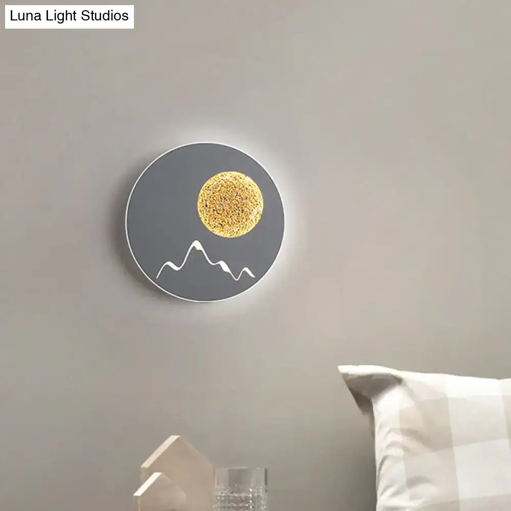 Nordic black white grey circular wall light with textured golden sphere and white mountain silhouette fixture height details
