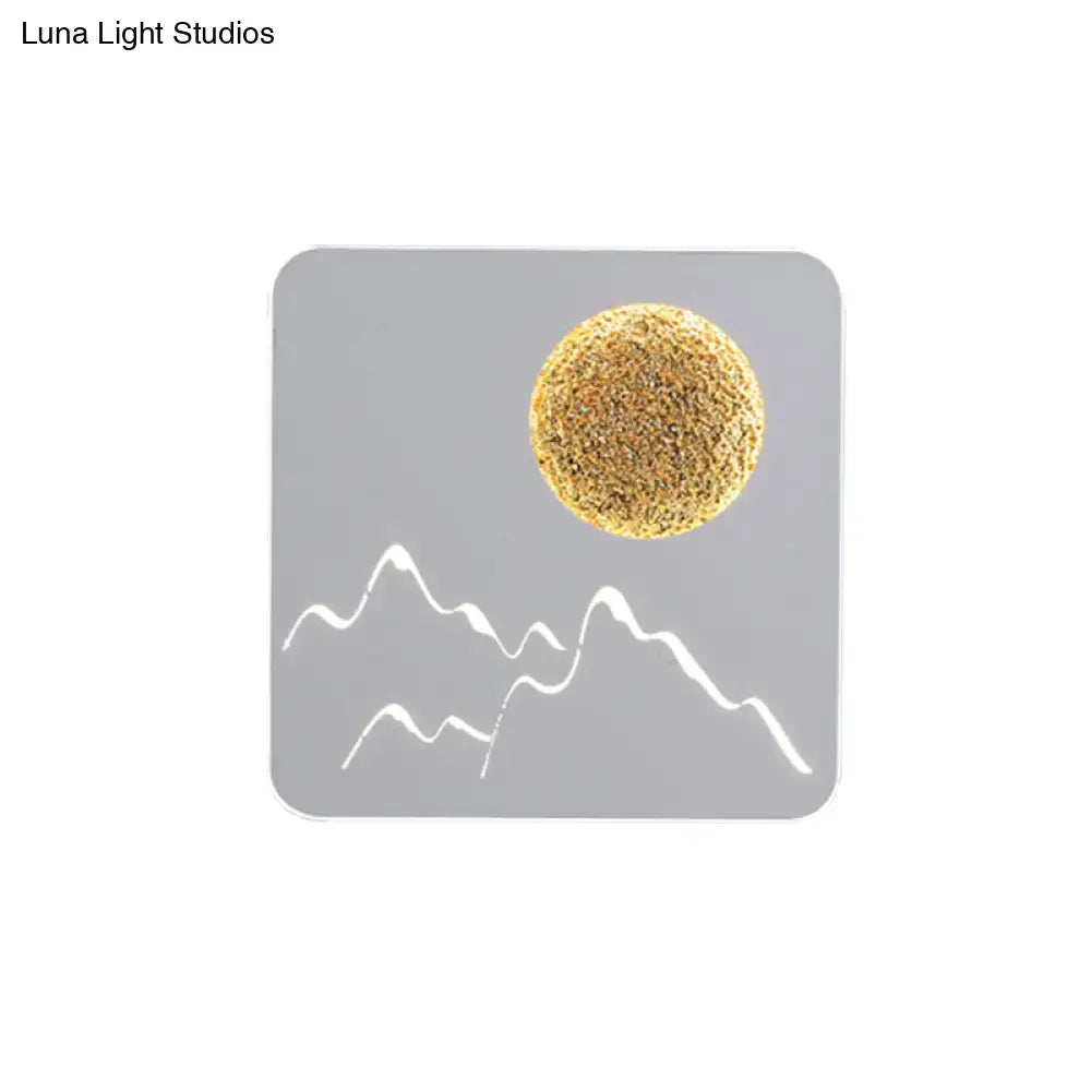 Gray square coaster with textured gold sphere and white mountain silhouettes for black white grey wall light fixture height