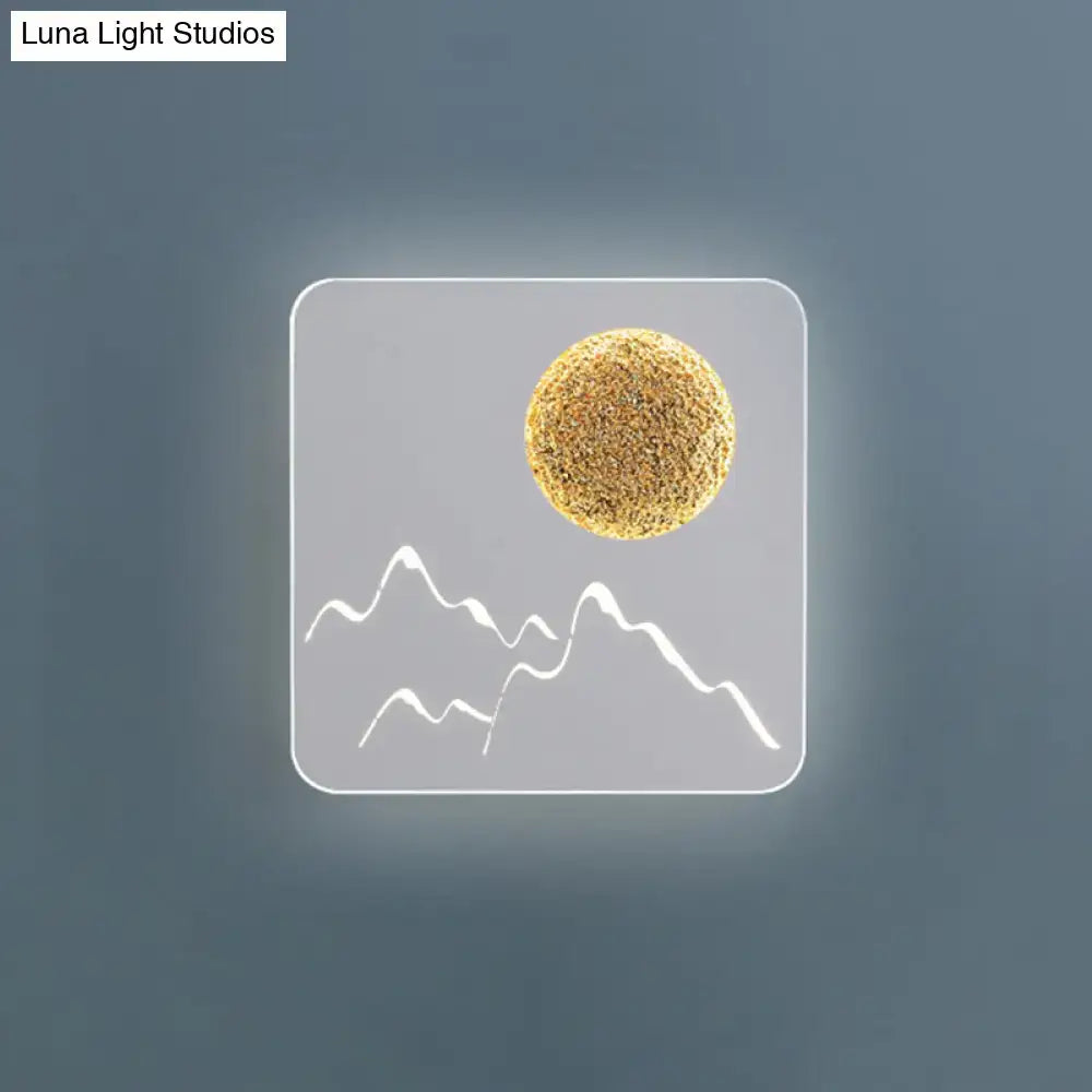 Modern black white grey wall light fixture with frosted glass panel featuring minimalist mountain and golden sun design