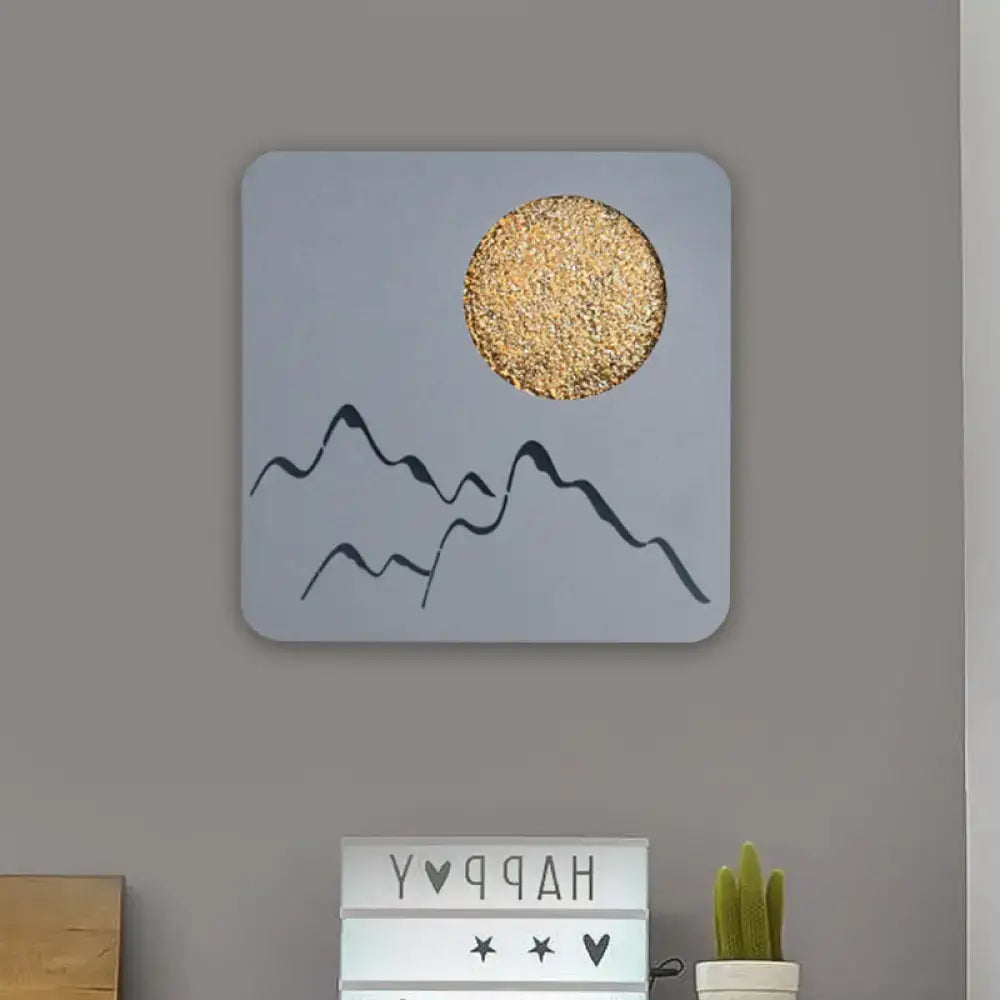 Square black white grey wall light featuring mountain silhouettes and textured gold sun with fixture height for bedroom use