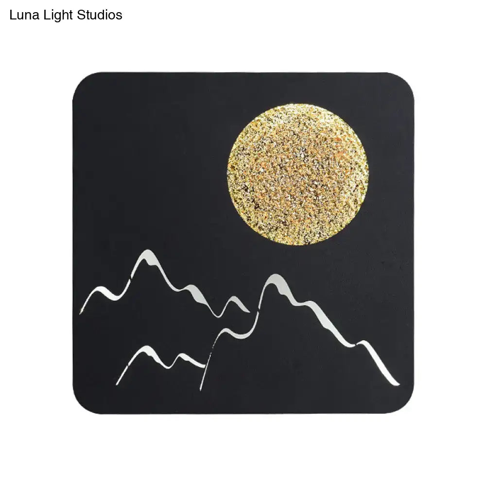Black white grey nordic wall light fixture featuring textured gold moon and white mountain silhouettes on black square coaster