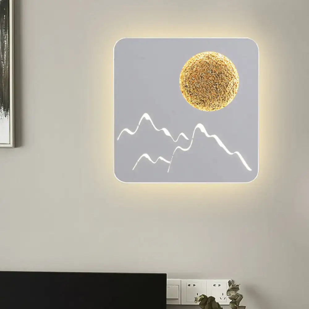 Nordic black white grey wall light with gray panel, white mountain silhouettes, and textured golden sun sphere fixture height