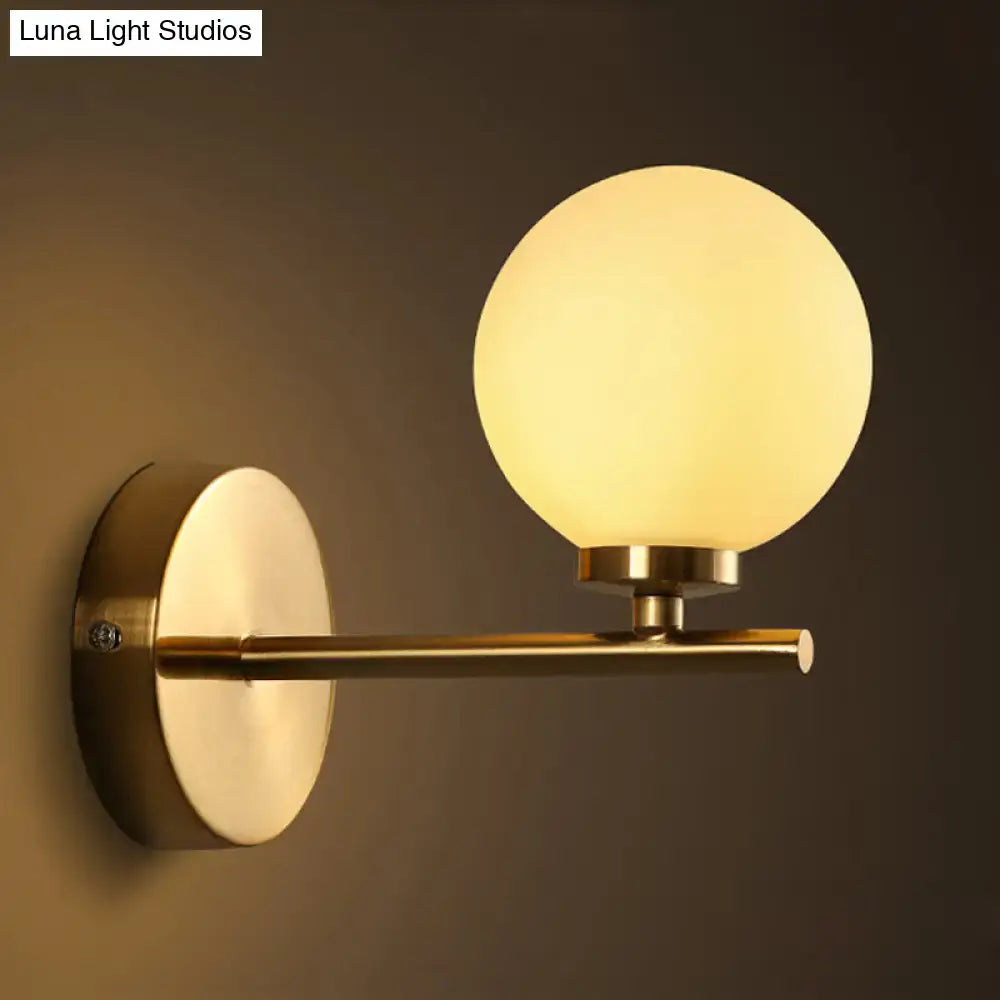 Brass-finished Nordic wall sconce light with frosted glass globe suitable for 110v-120v 220v-240v bedroom lighting