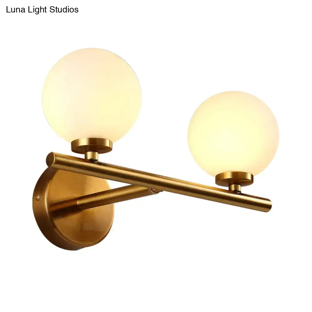 Brass-finished nordic wall sconce light with two frosted glass globe shades for bedroom lighting 110v-120v 220v-240v