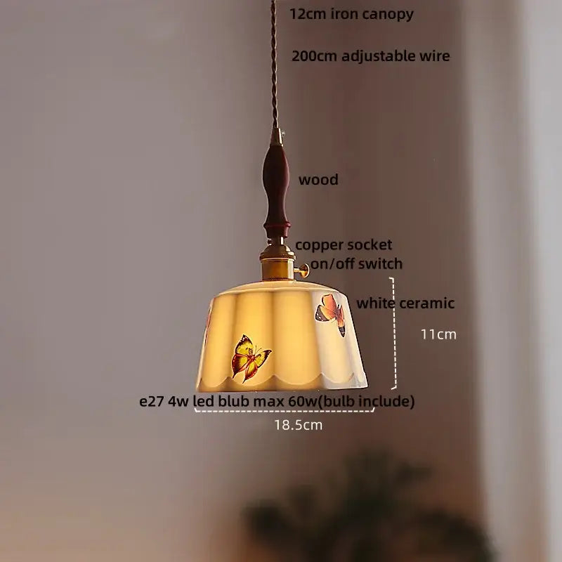 Delicate white ceramic pendant light with scalloped edge and butterfly motifs features decorbites brown wood led handle