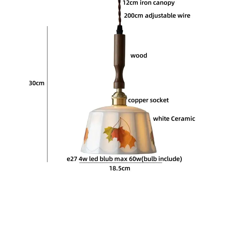 A white ceramic pendant light with autumn leaf decals, wooden handle, and copper socket for nordic brown wood led decorbites